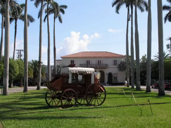 A tropical wonderland of palms, ferns, bromeliads, fountains, sculptures, rocks, ironwork gates, and pergolas, with the delightful scent of flowers filling the air.