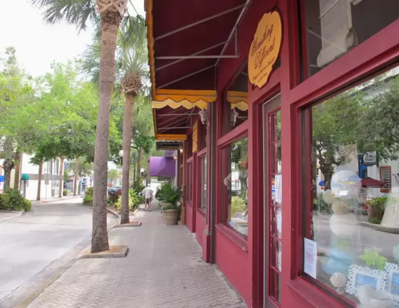 A cute historic area with sidewalk cafes and a waterfront park.