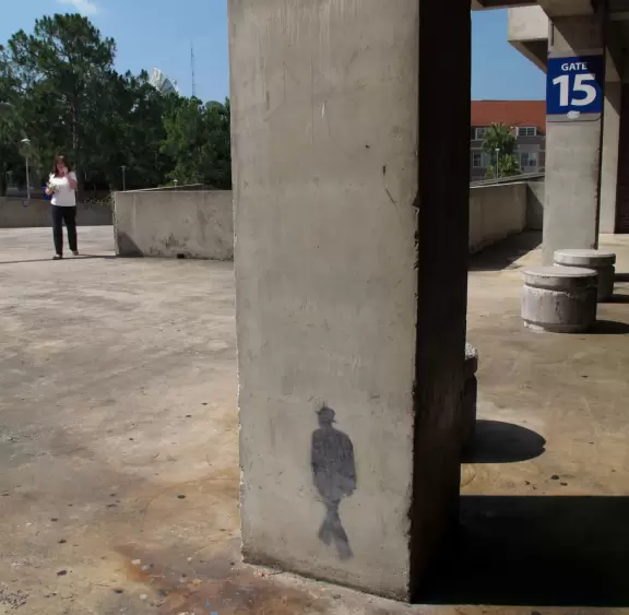 Painted shadow on the pillar in the football stadium- so cool!