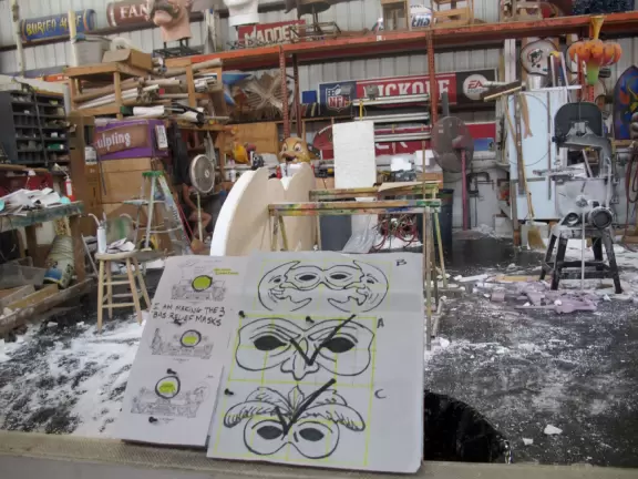 &quot;I am making the 3 bas relief masks,&quot; writes an artist on the poster.