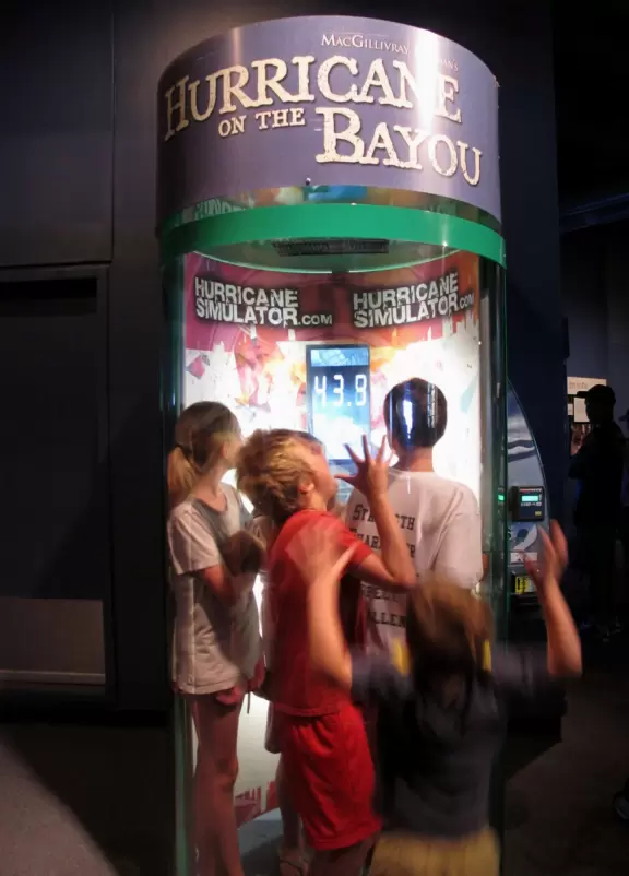 Kids enjoy the hurricane simulator.