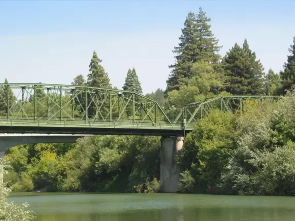 A wide, pebbly shore where you can enter the Russian River on kayak or paddleboat, have a beer, or walk the historic Guerneville Bridge.